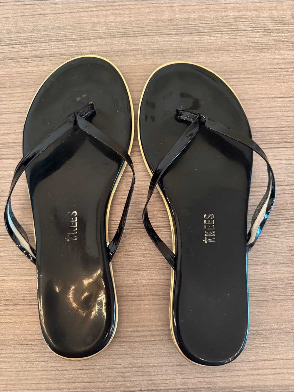 TKEES Black Patent Flip Flop Sandals with Gold Trim
